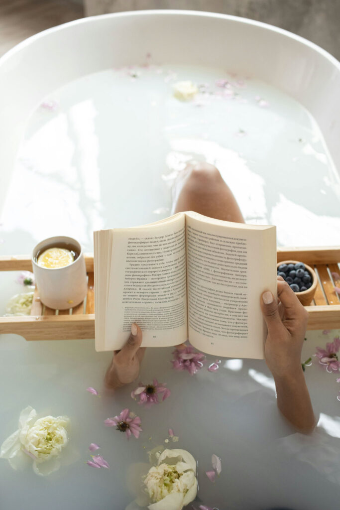 girl in bath tub reading at a luxury lodging in Texas Hill Country